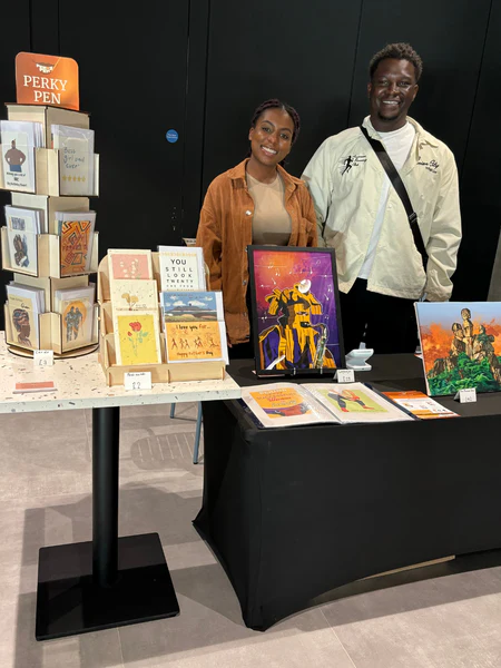 Perky Pen founders Victry and Tobi showcasing their greeting cards UK